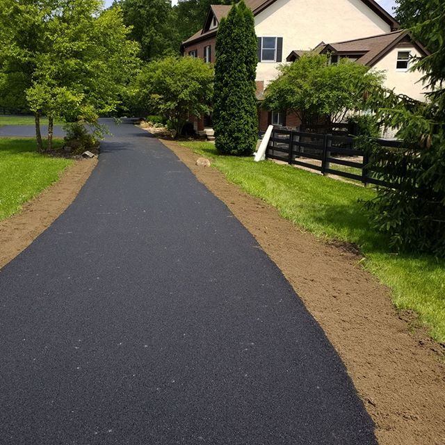 Tree-lined private driveway freshly paved