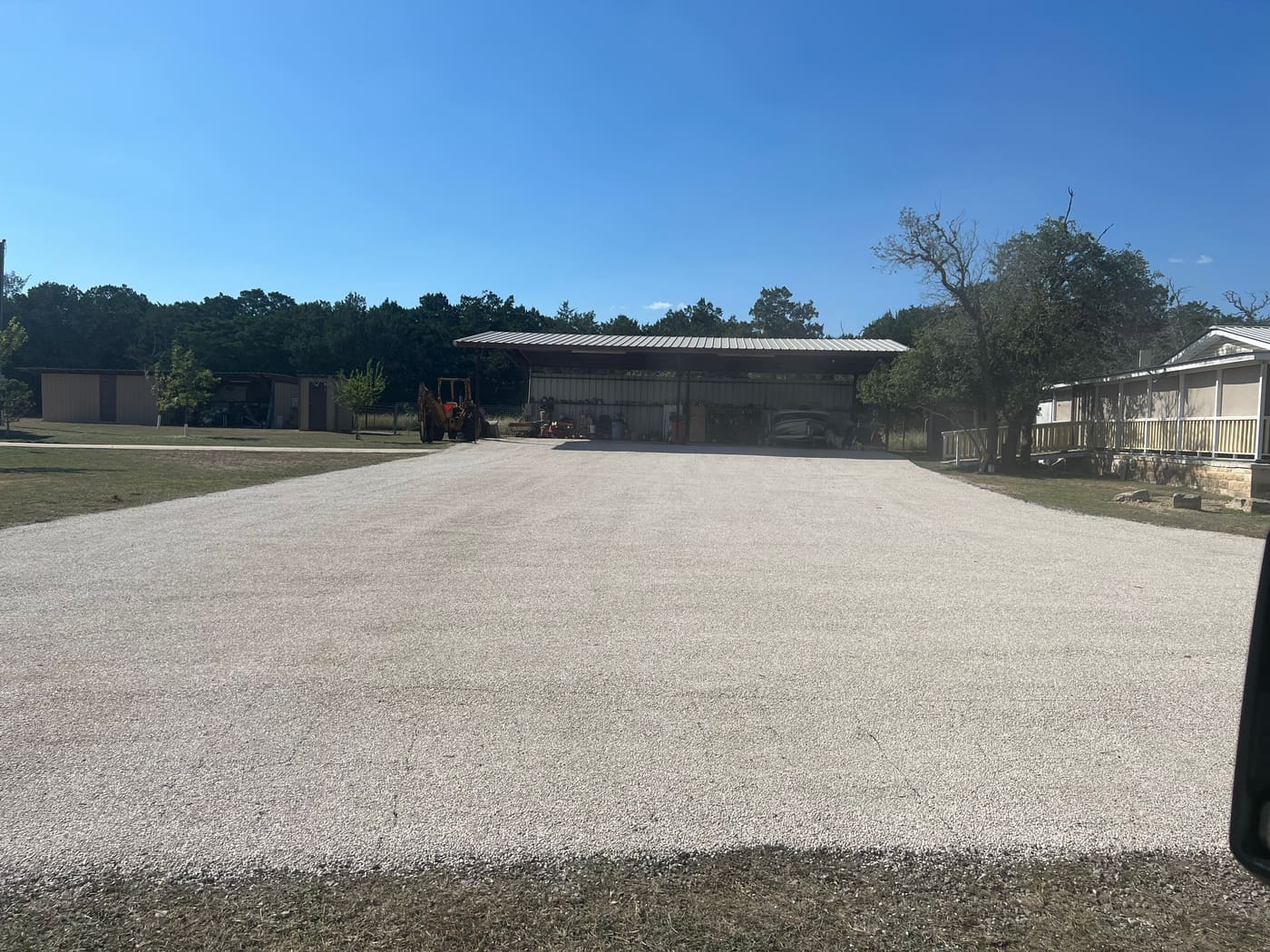 Chip seal surface being rolled into place