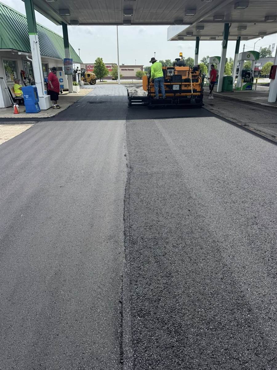 Paver at work on a commercial gas-station lot