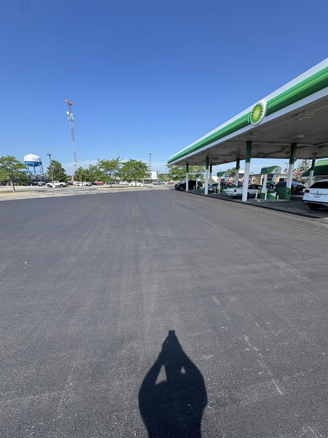 Freshly paved parking lot with painted ADA stripes